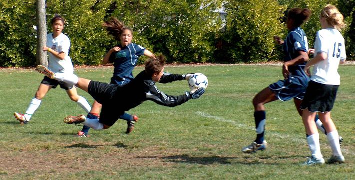 Santa Clara's Bianca Henninger saves a shot from Stanford's Lindsay Taylor in a U15 league.