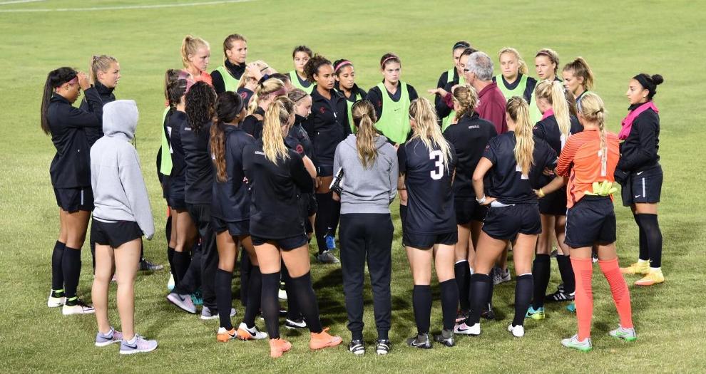 Women's soccer huddles during an Aug. 11 exhibition vs. Seattle.