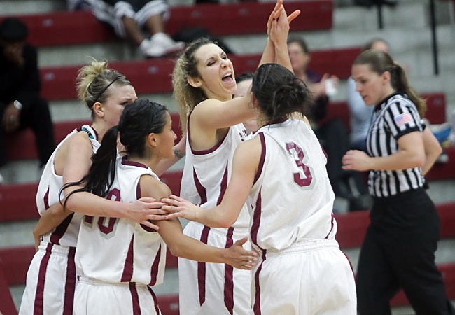 Lindsay Leo (center) and the Broncos celebrate during the team's win over Seattle on Sunday (John Medina Photo)