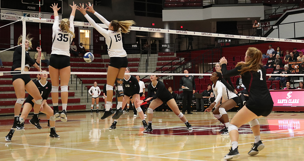 Michelle Gajdka (35) and Taylor Odom (15) turn back an attack attempt by Pacific on Thursday, Oct. 19, 2017 in Leavey Center.